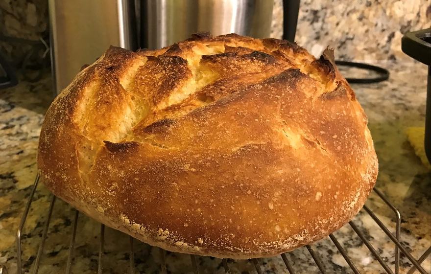 A loaf on a cooling rack